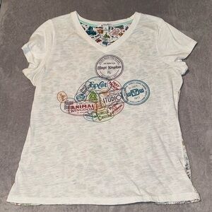 Disney Parks Shirt Women’s XL White V-Neck Park Logos Stamps‎